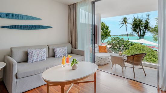 Living Area and Balcony in Grand Deluxe Ocean View